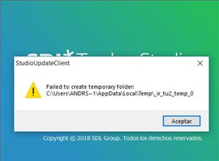 Error message from StudioUpdateClient stating 'Failed to create temporary folder' with a file path and an 'Accept' button.