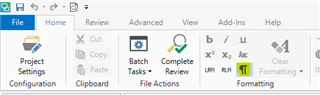 Trados Studio screenshot showing the Home tab with options like Project Settings, Clipboard, Batch Tasks, and a highlighted 'Complete Review' button.