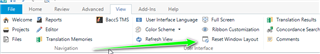 Trados Studio screenshot showing the 'View' tab with an arrow pointing to the 'Reset Window Layout' option.