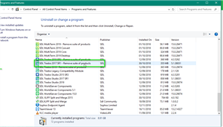 Control Panel window showing a list of installed programs including multiple versions of Trados Studio and MultiTerm.