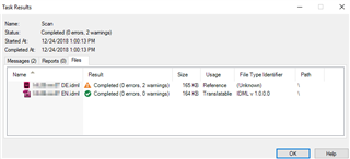 Trados Studio task results window showing two files: 'Only_EN.idml' marked as 'Completed (0 errors, 2 warnings)' and 'Only_DE.idml' marked as 'Completed (0 errors, 0 warnings)'. Both files are 194 KB in size.