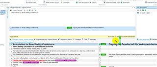 Screenshot of Trados Studio's translation results pane with a highlighted segment and a yellow warning symbol indicating a potential issue.