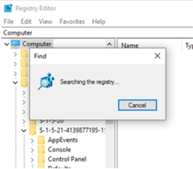 Registry Editor window displaying a 'Searching the registry...' dialog box indicating the search is in progress.