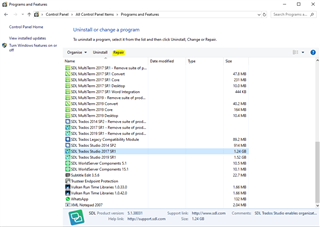 Screenshot of the Programs and Features window showing a list of installed software, including SDL Trados Studio 2017 SR1 with the option to 'Uninstall' or 'Change'.