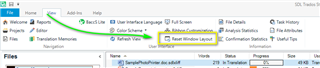 Trados Studio screenshot showing the 'View' tab with an arrow pointing to 'Reset Window Layout' option.