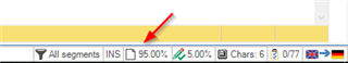 Trados Studio editor screen showing segment status at the bottom right with a red arrow pointing to it.