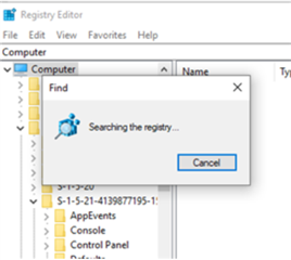Registry Editor window displaying a progress dialog box with the message 'Searching the registry...' and a cancel button.