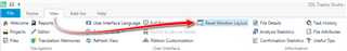 Screenshot of Trados Studio showing the View menu with an arrow pointing to the 'Reset Window Layout' option.