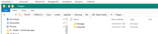 Screenshot of Trados Studio showing the Plugins folder within the File Explorer, indicating the folder is empty with no remaining files before reinstalling plugins.