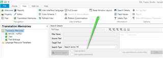 Screenshot of Trados Studio showing the Translation Memories view with a green arrow pointing to the Reset Window Layout option in the View tab.