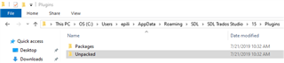 Screenshot of Trados Studio 2019 plugins directory showing an empty folder with only 'Packages' and 'Unpacked' subfolders.