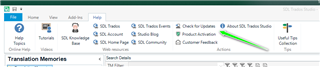 Trados Studio interface showing the 'Help' tab with an arrow pointing to 'Check for Updates' option.