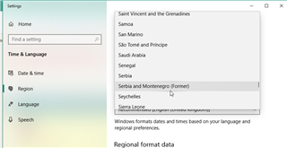 Windows Settings window showing Time & Language options with Region settings open, displaying a list of countries including Serbia and Montenegro (Former).