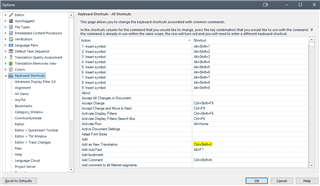 Trados Studio 2021 Options window showing Keyboard Shortcuts tab with a list of actions and their associated shortcut keys.