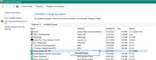 Programs and Features window with a list of installed programs, Trados Studio 2021 highlighted and the UninstallChange option visible.
