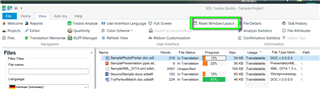 Trados Studio screenshot showing the 'View' tab with 'Reset Window Layout' option highlighted in the dropdown menu.