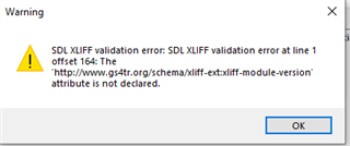 Warning dialog box showing SDL XLIFF validation error at line 1 offset 164: The 'http:www.sdltrados.comschemaxliff-extxliff-module-version' attribute is not declared.