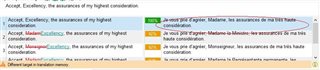 Screenshot showing Trados Studio Ideas translation results window with 'Different target in Translation Memory' warning and track changes highlighting differences in the target field.