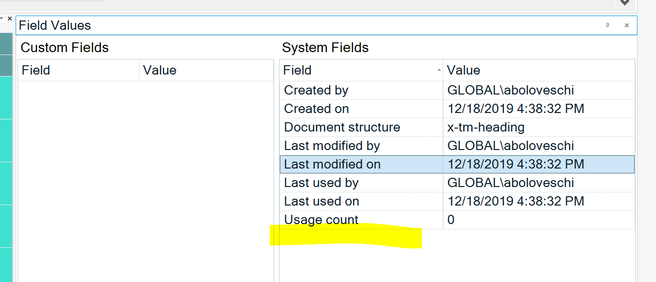 Screenshot of Trados Studio showing Field Values window with Custom Fields and System Fields. System Fields display metadata such as 'Created by', 'Created on', and 'Usage count' highlighted with a yellow marker indicating a focus or issue.