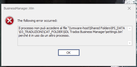 Error message in Trados Business Manager stating 'The process cannot access the file settings.bin because it is being used by another process.' with an OK button.