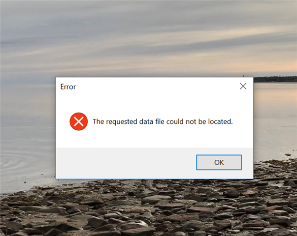 Error message window on a computer screen with a red cross symbol, stating 'The requested data file could not be located.' with an 'OK' button.