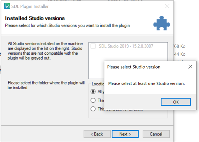 SDL Plugin Installer window with an error message 'Please select at least one Studio version.' The 'Installed Studio versions' list is visible with 'SDL Studio 2019 - 15.2.8.3007' option greyed out and unselectable.